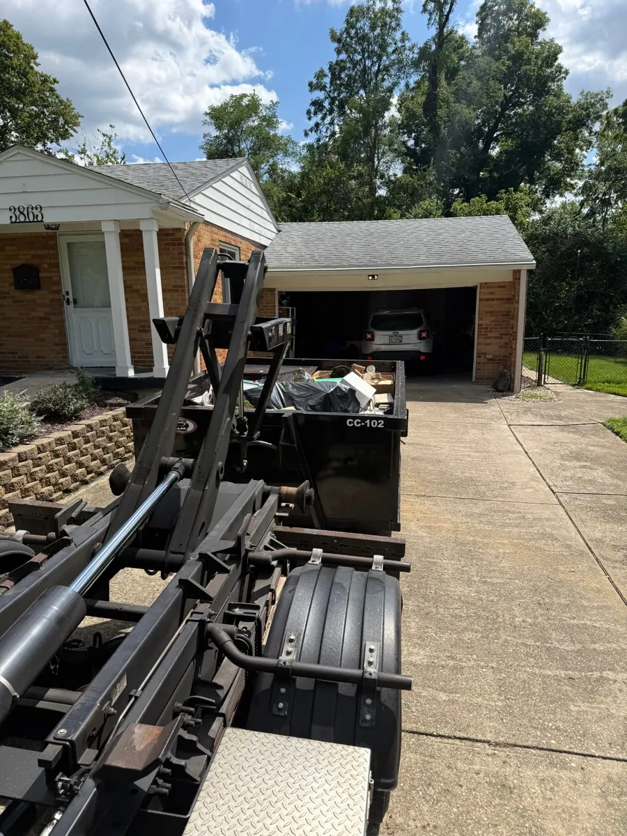 Clutter Cleanout 10 yard dumpster CC-102 loaded on a Sharonville OH driveway during a garage cleanout