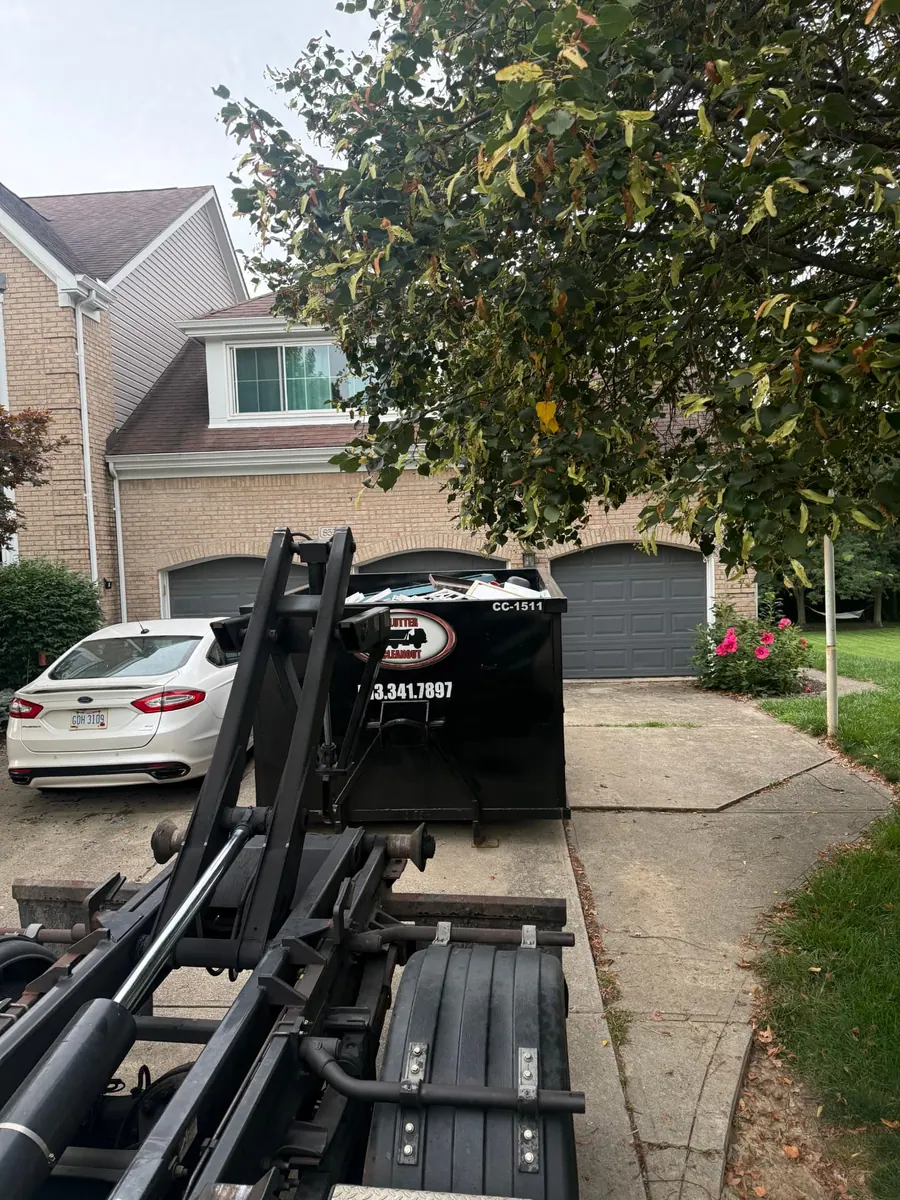 Clutter Cleanout 15 yard dumpster CC-1511 loaded with remodel debris on a West Chester, OH driveway