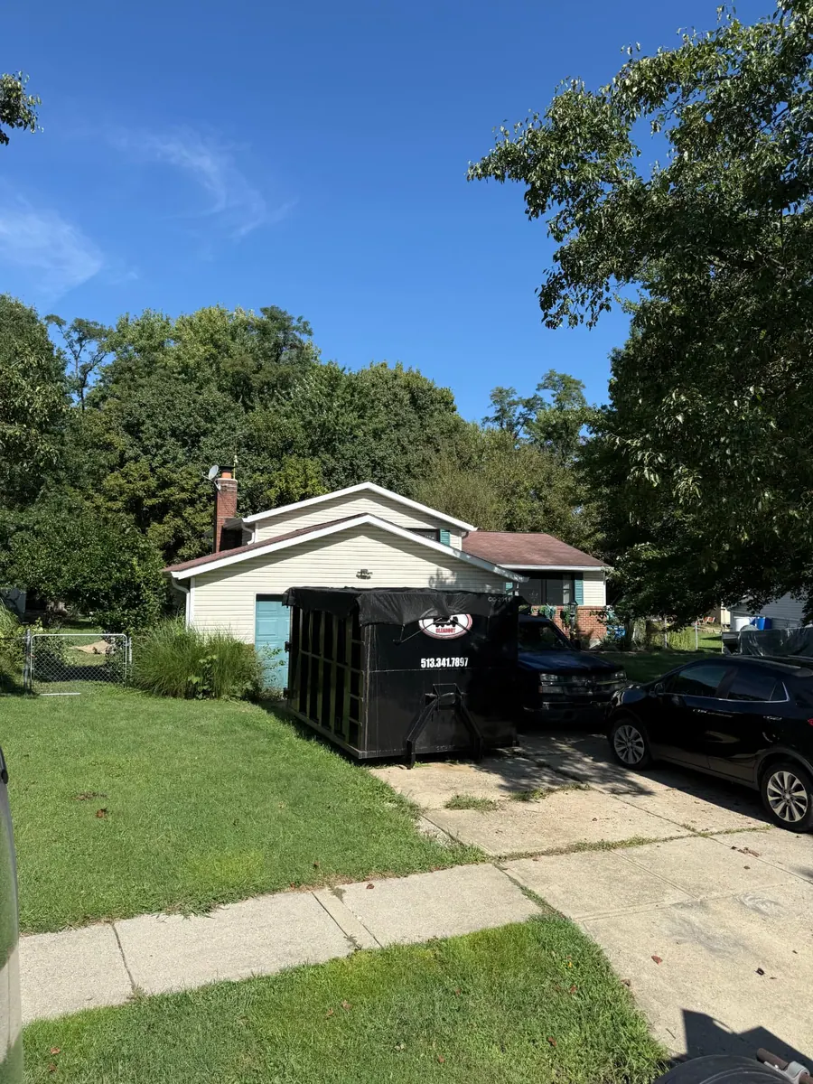 Tarped Clutter Cleanout 20 yard dumpster placed on a residential driveway in Batavia, OH