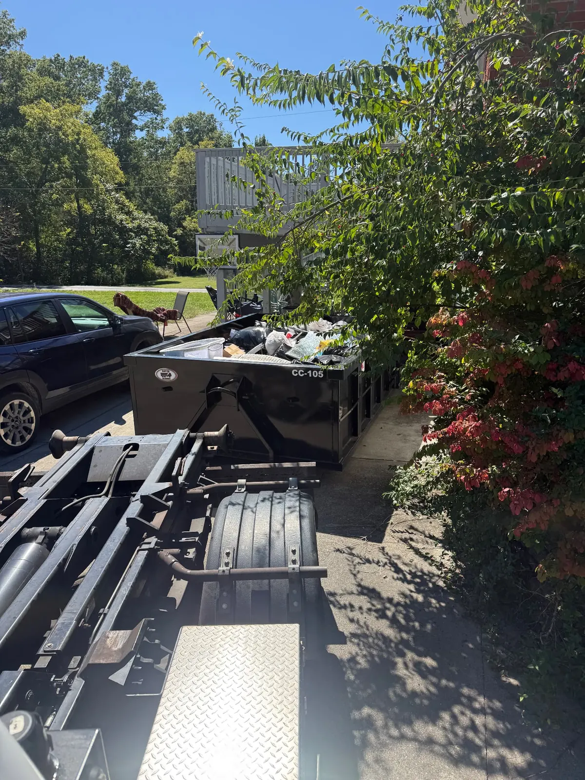 Loaded Clutter Cleanout 10 yard dumpster CC-105 collected from a residential driveway in Milford, OH