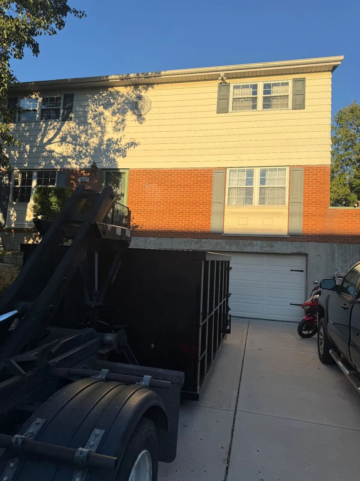 Clutter Cleanout 15 yard dumpster delivered to a residential driveway in Cincinnati, OH