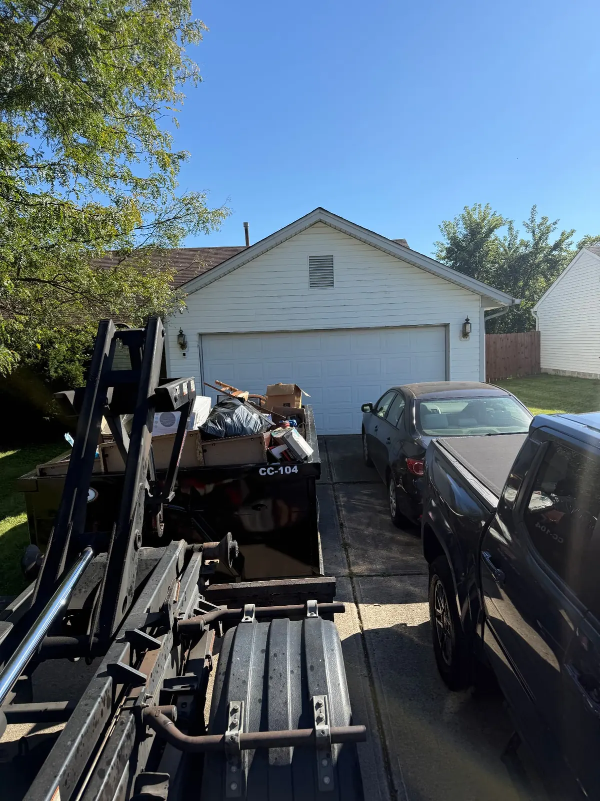 Loaded Clutter Cleanout 10 yard dumpster CC-104 collected from a residential driveway in Cincinnati, OH
