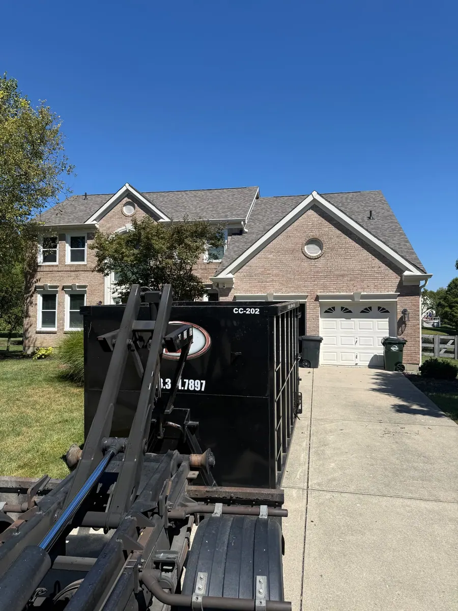 Clutter Cleanout 20 yard dumpster CC-202 delivered to a brick home driveway in Mason OH