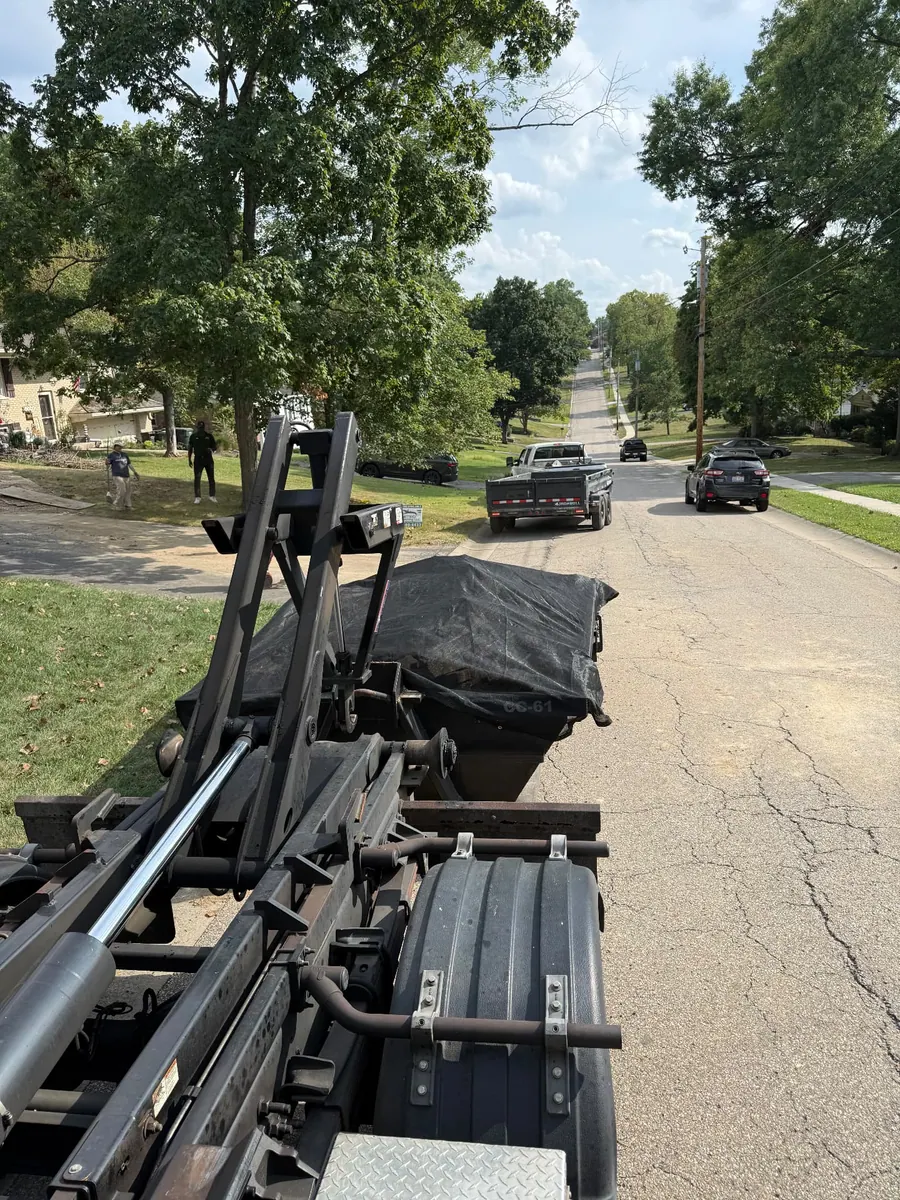 Clutter Cleanout 6 yard concrete dumpster CC-61 tarped and loaded on a street in Anderson Township, OH