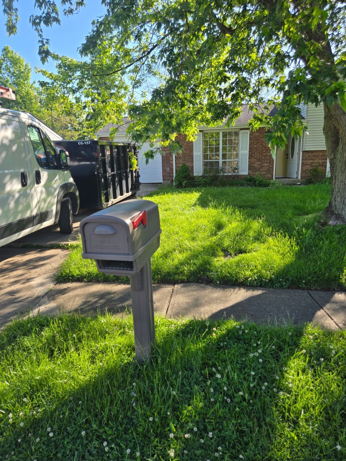 15-yard Clutter Cleanout construction dumpster CC-157 delivered to a residential driveway in Alexandria, KY