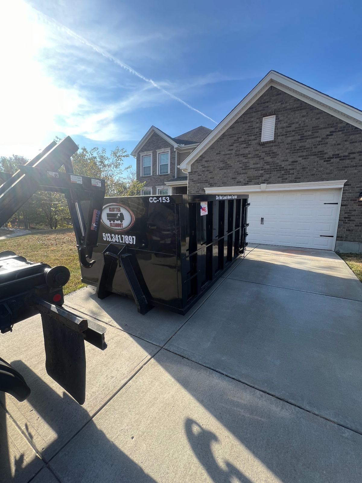 Clutter Cleanout dumpster CC-153 delivered to Batavia OH driveway for garage cleanout