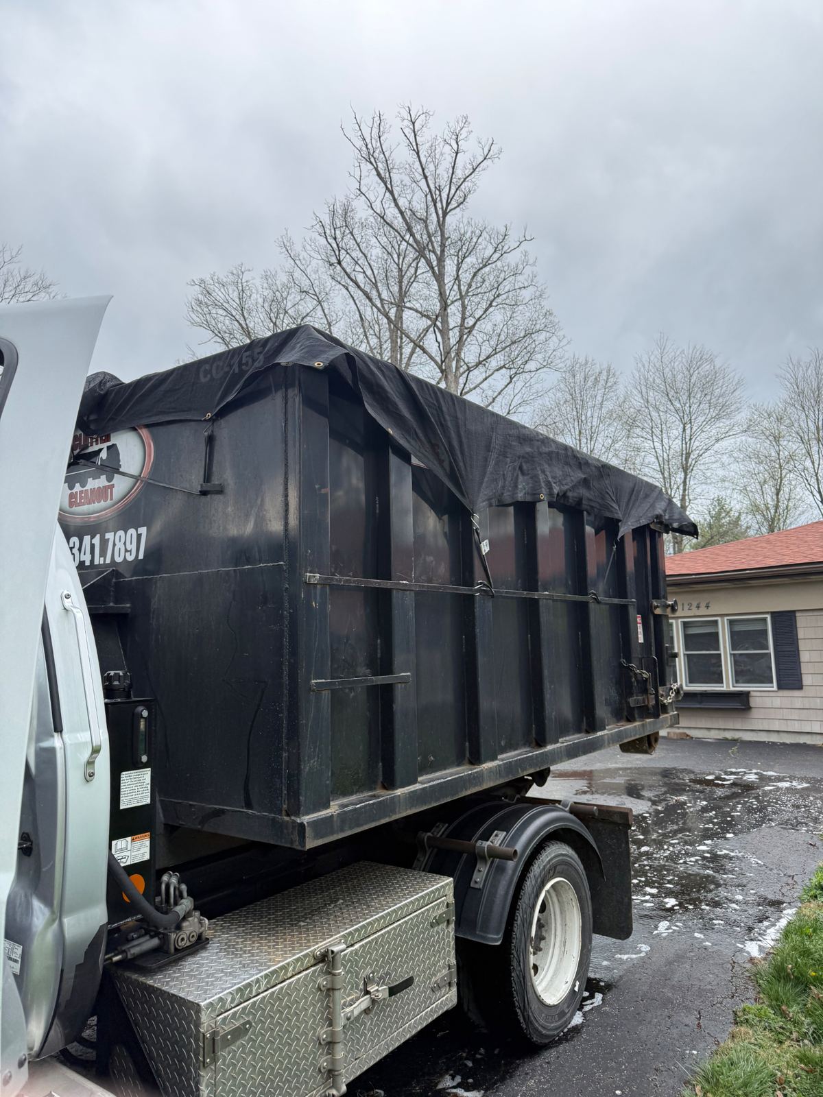 Full loaded dumpster pickup after basement cleanout in Florence KY