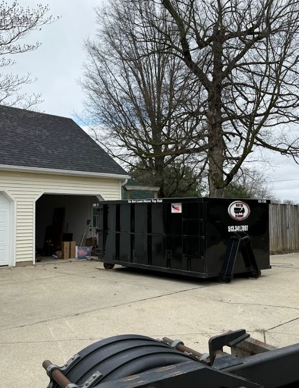 Dumpster positioned for easy loading during home renovation project