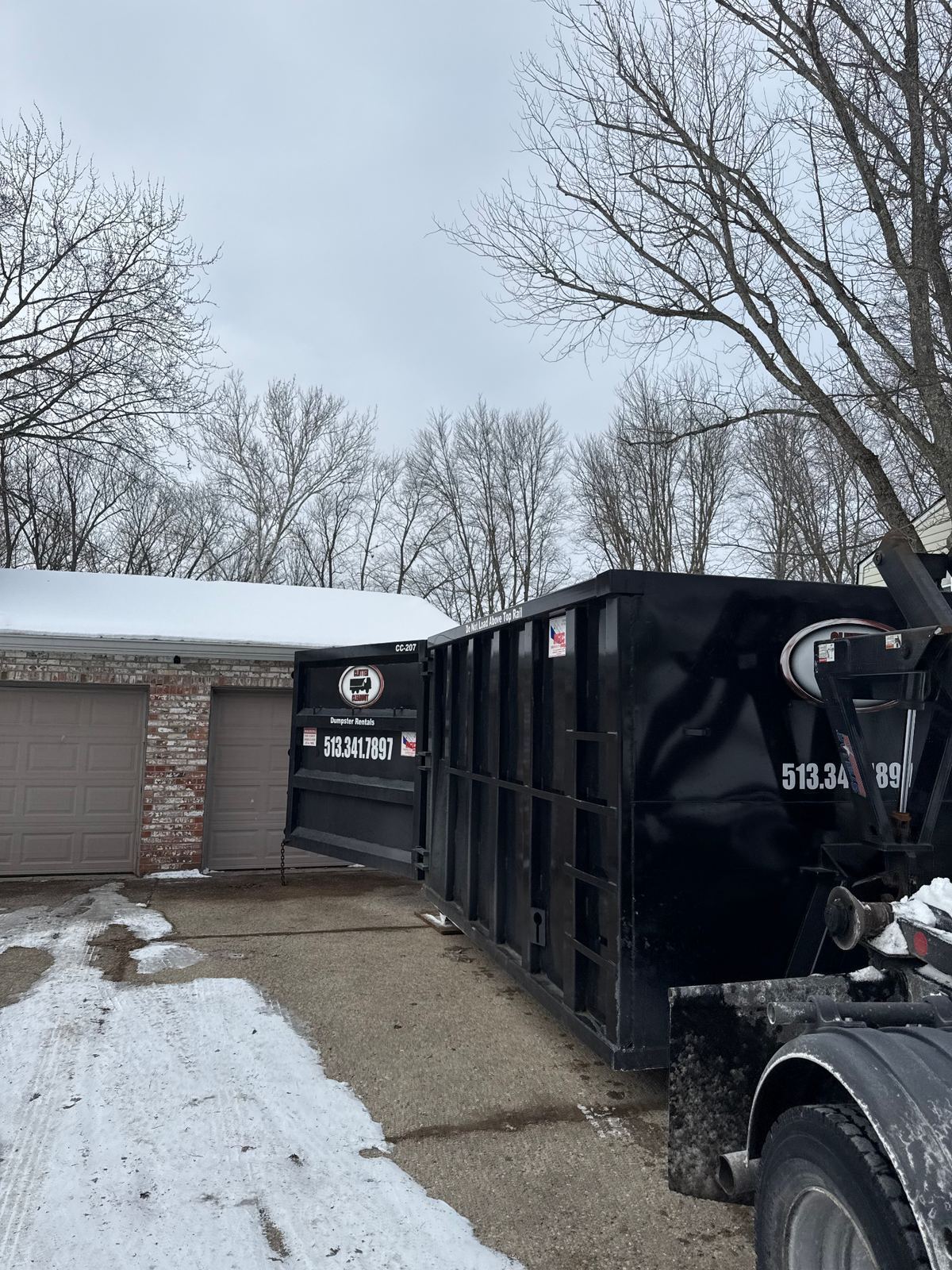 Clutter Cleanout dumpster CC-207 being dropped off at a Blue Ash OH residence for a garage cleanout