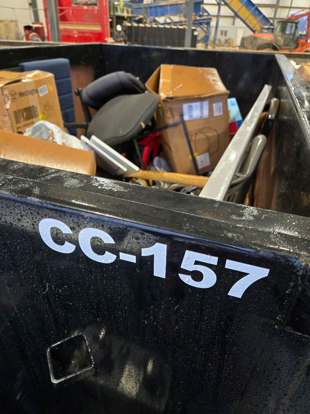 Clutter Cleanout dumpster CC-157 full of debris from Burlington job