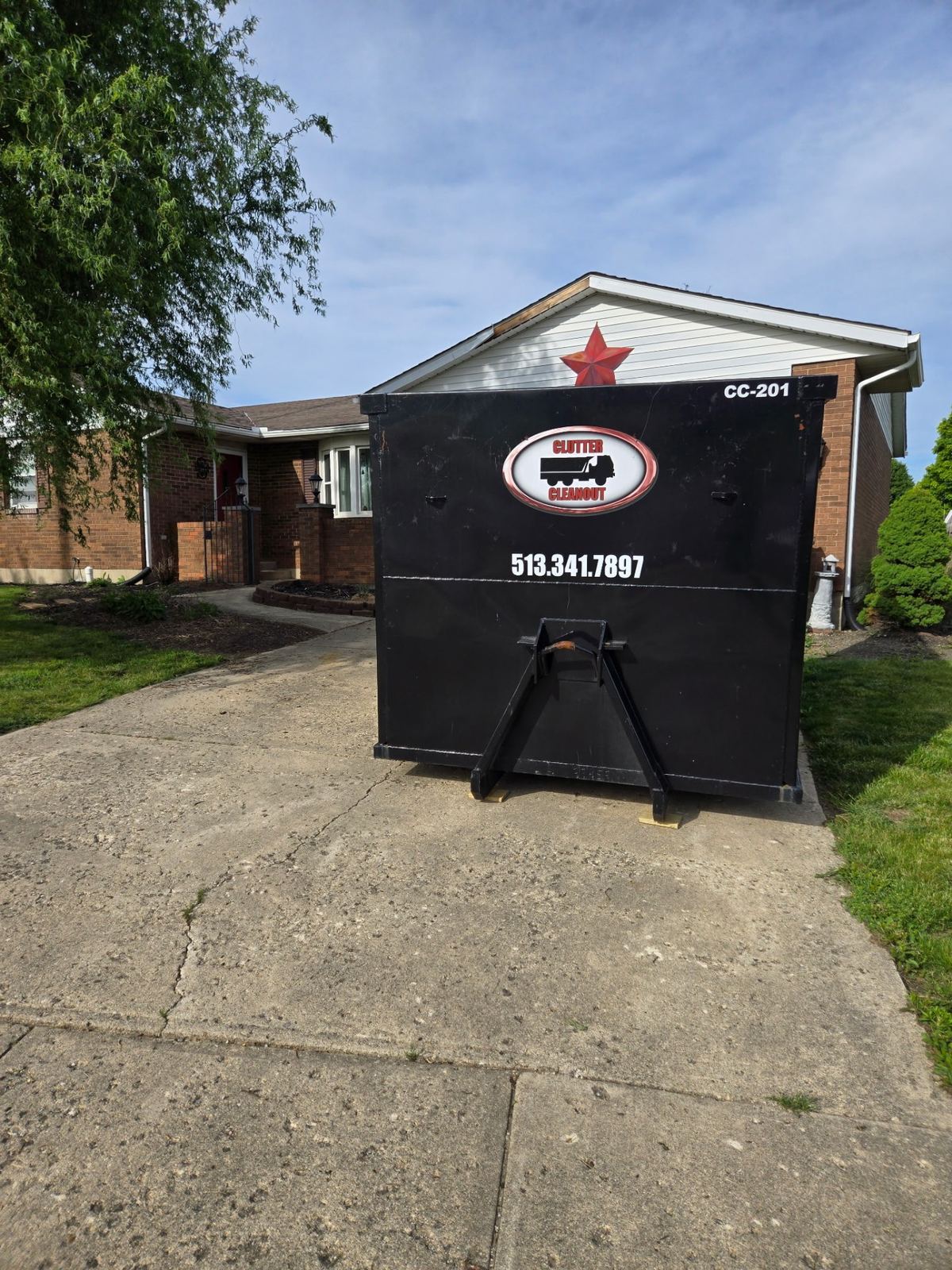 Clutter Cleanout 20 yard dumpster CC-201 set on a Crescent Springs KY driveway for a home cleanout