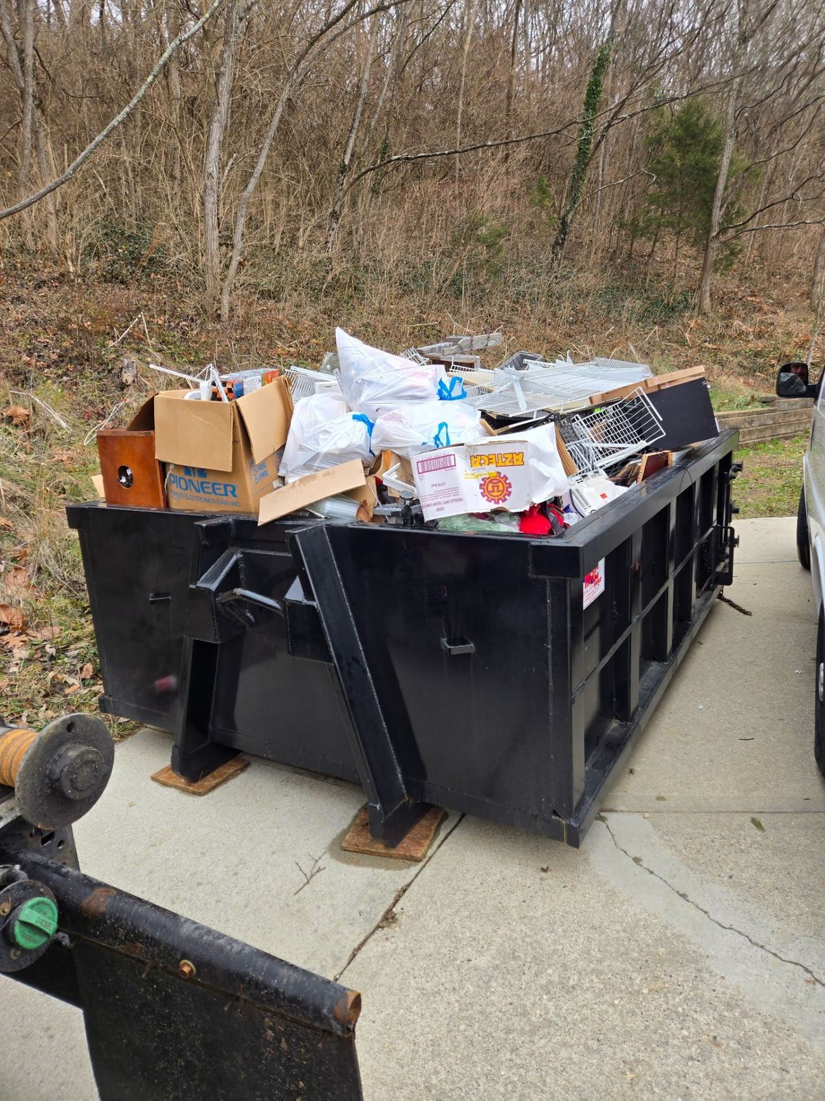 Clutter Cleanout dumpster rental in Crestview Hills KY filled with household items