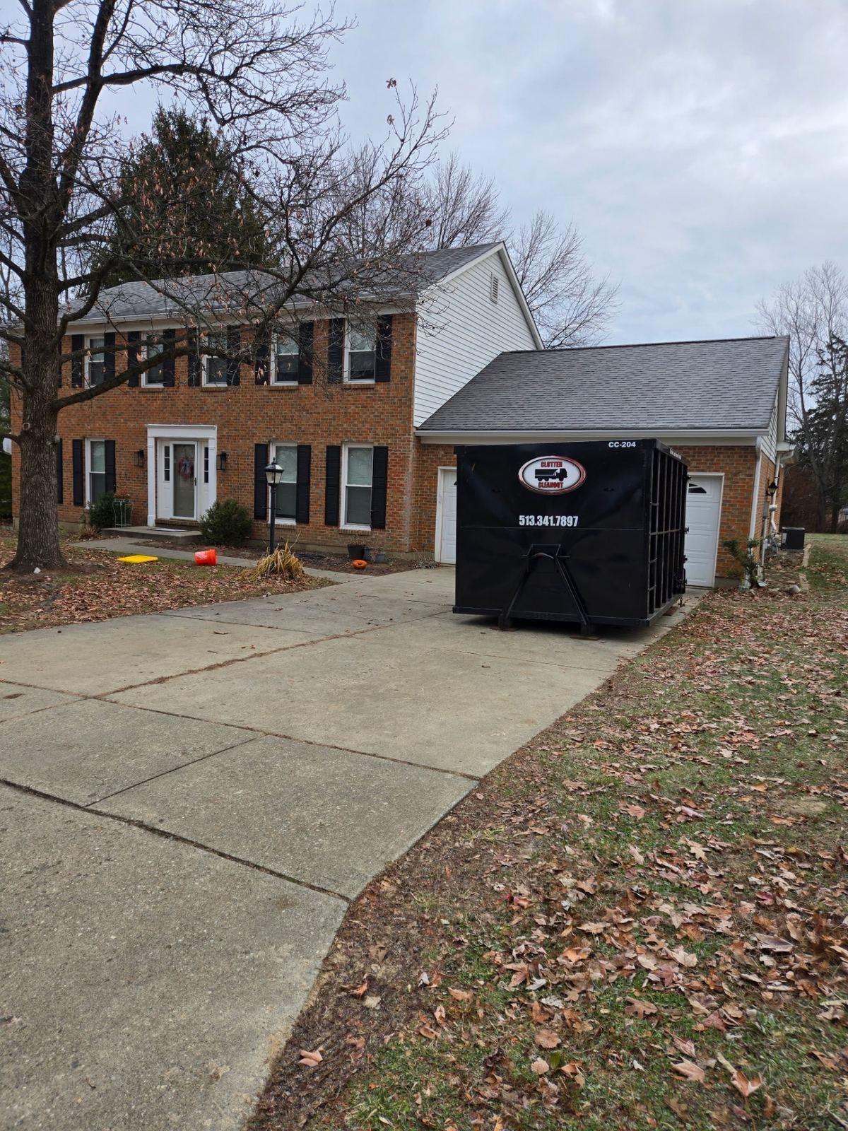 Clutter Cleanout dumpster rental delivered to Dayton KY home for cleanout