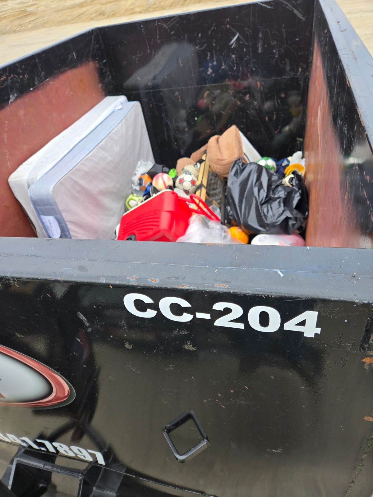 Loaded Clutter Cleanout dumpster CC-204 with household junk from Dayton KY cleanout
