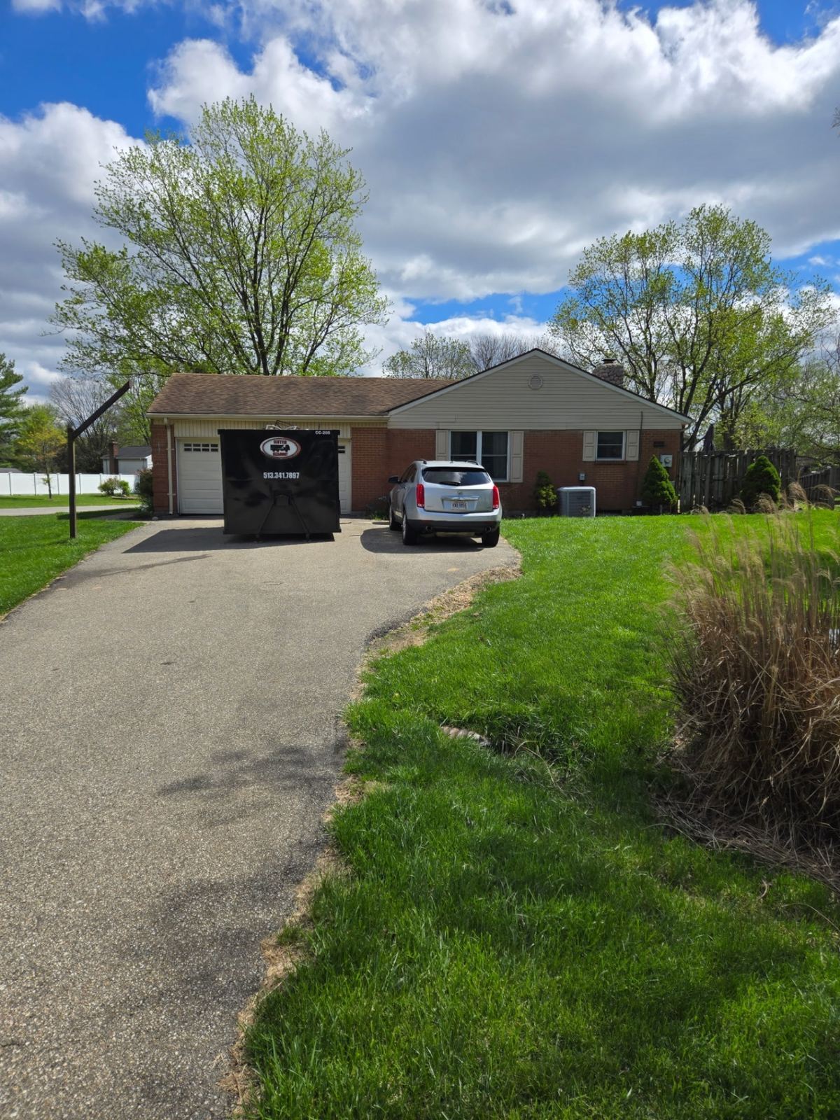 Dumpster rental delivered to brick ranch home in Batavia OH for estate cleanout