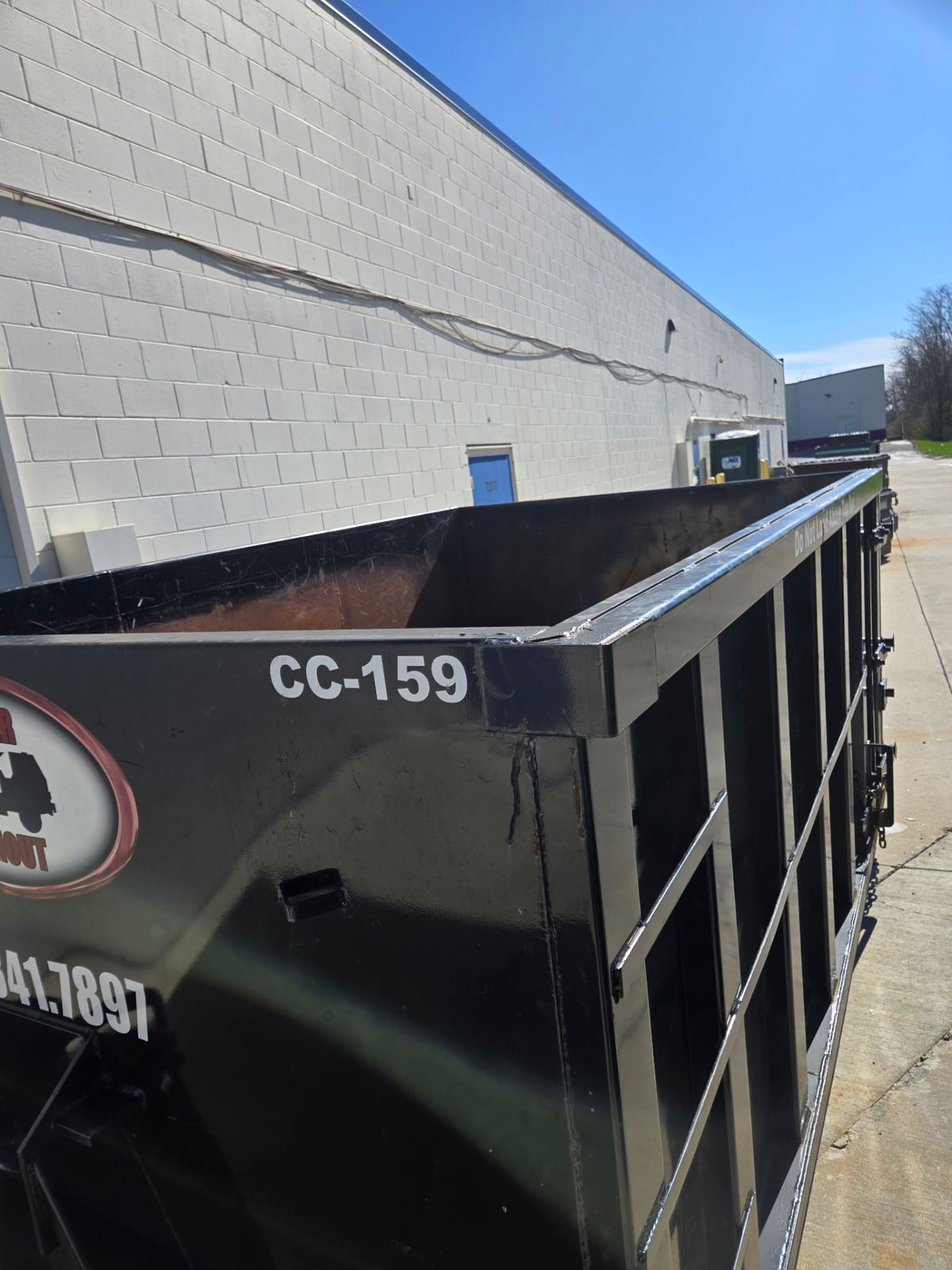 Clutter Cleanout 15-yard dumpster CC-159 at a commercial building in Florence, KY ready for demolition debris