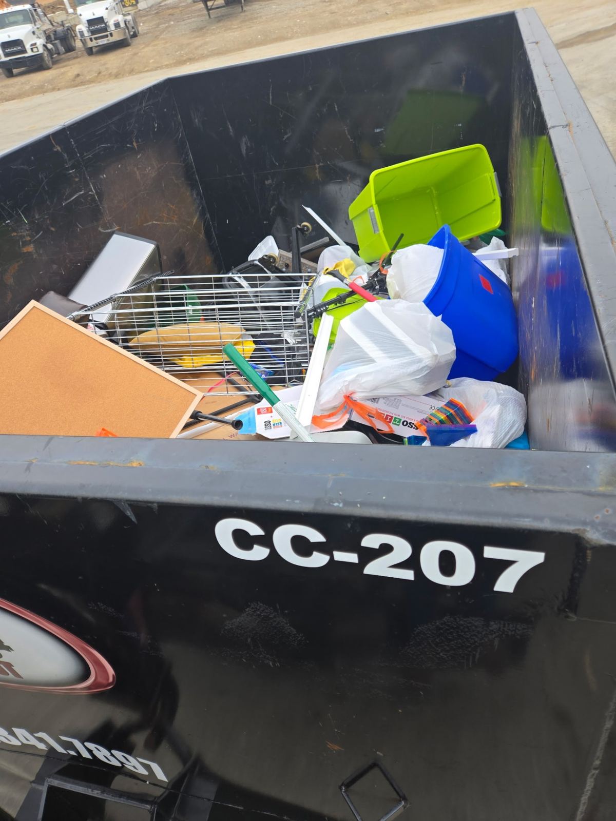 Loaded Clutter Cleanout dumpster CC-207 with household junk from Fort Thomas cleanout