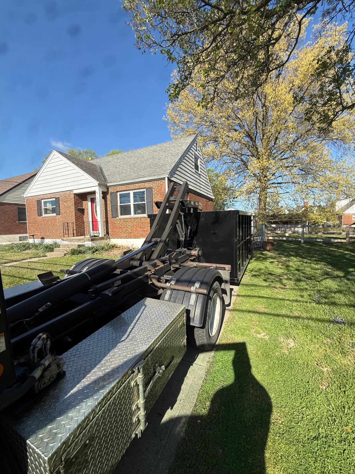 20 yard dumpster filled with renovation debris including drywall and cabinets in Maineville OH