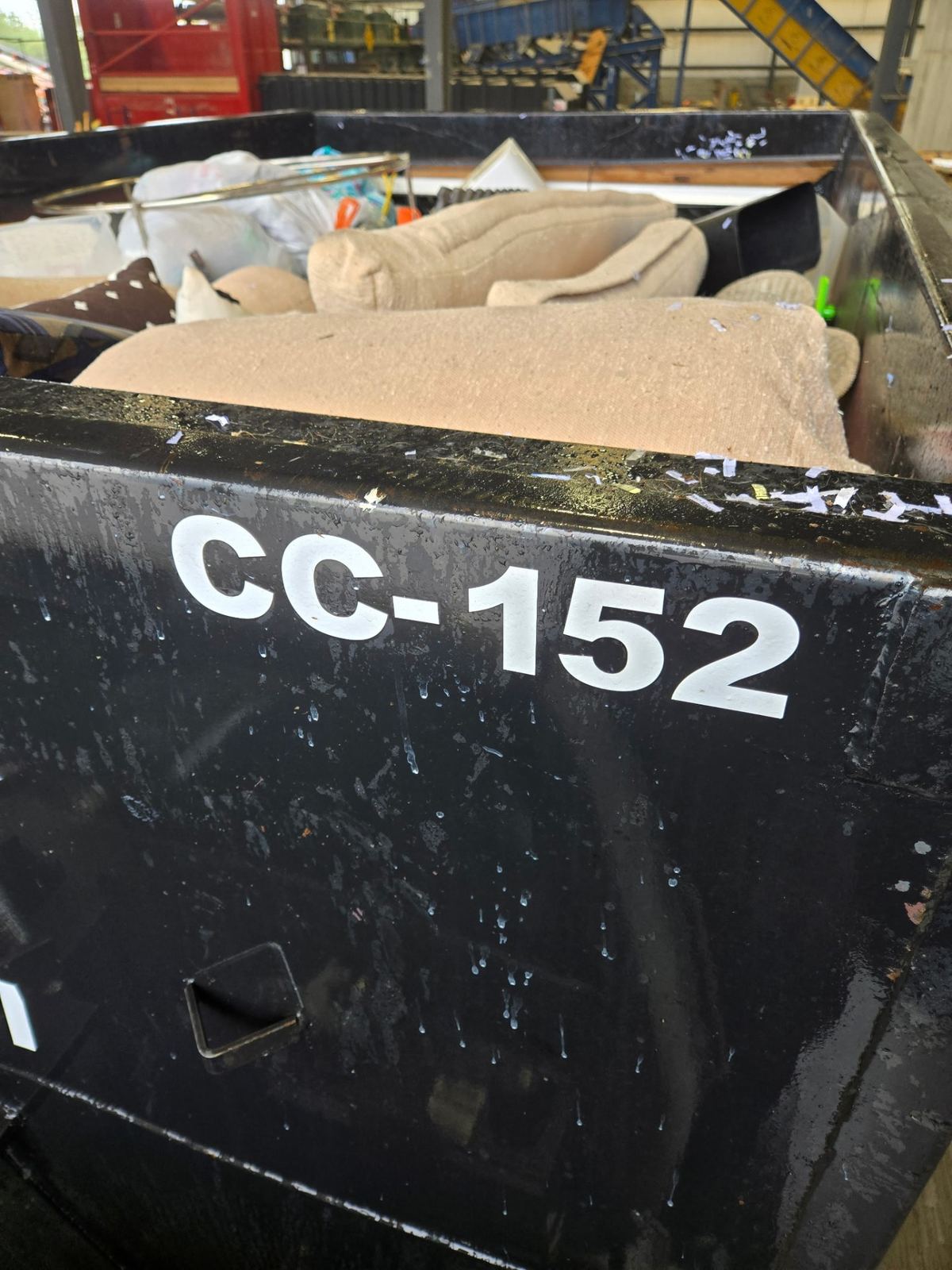 Close-up of Clutter Cleanout dumpster CC-152 loaded with furniture during Kenwood OH cleanout