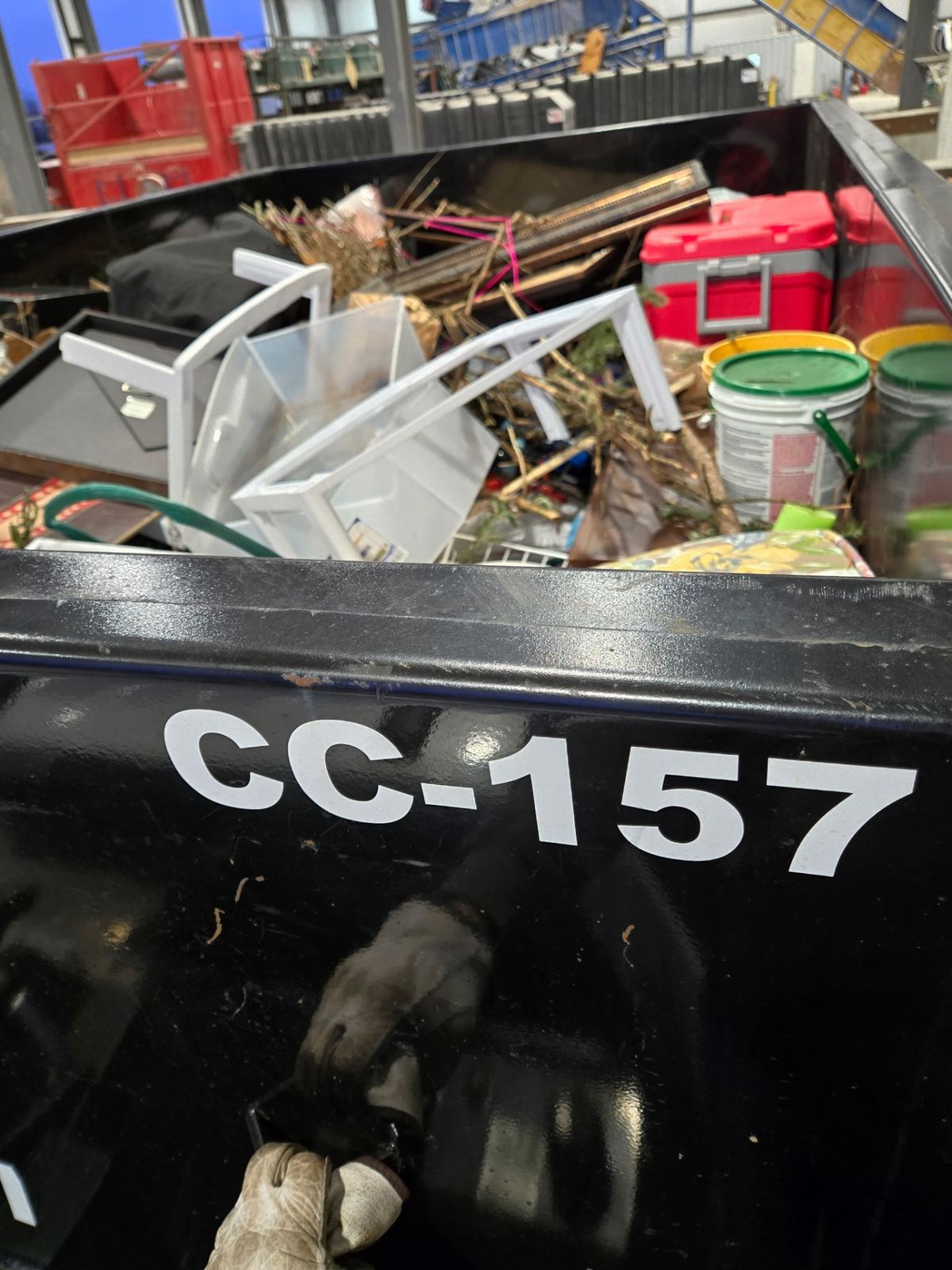 Close-up of Clutter Cleanout dumpster CC-157 loaded with household items and yard waste in Lebanon OH