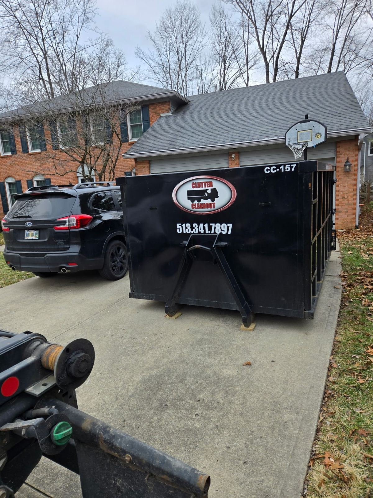 Clutter Cleanout dumpster CC-157 delivered to a driveway for a home cleanout in Maineville OH
