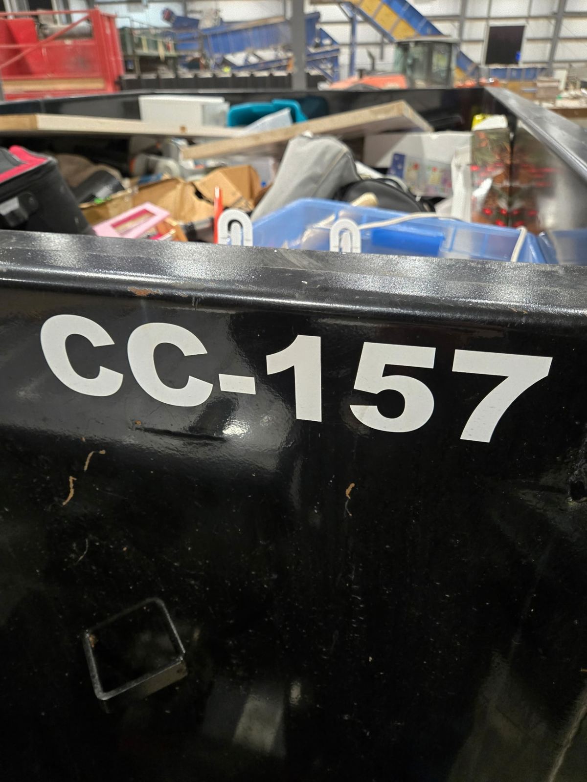 Close-up of Clutter Cleanout dumpster CC-157 loaded with household items during Maineville OH cleanout