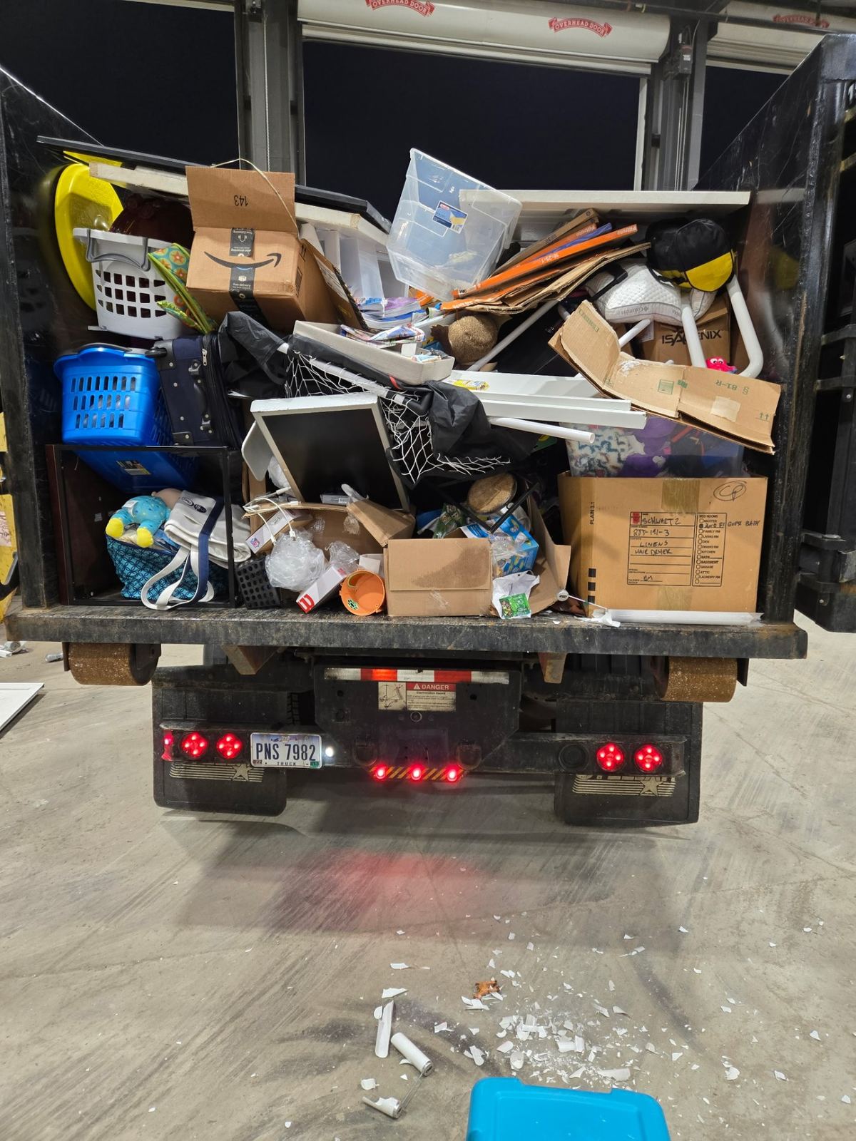 Fully loaded dumpster with boxes furniture and household clutter from a Maineville OH cleanout project