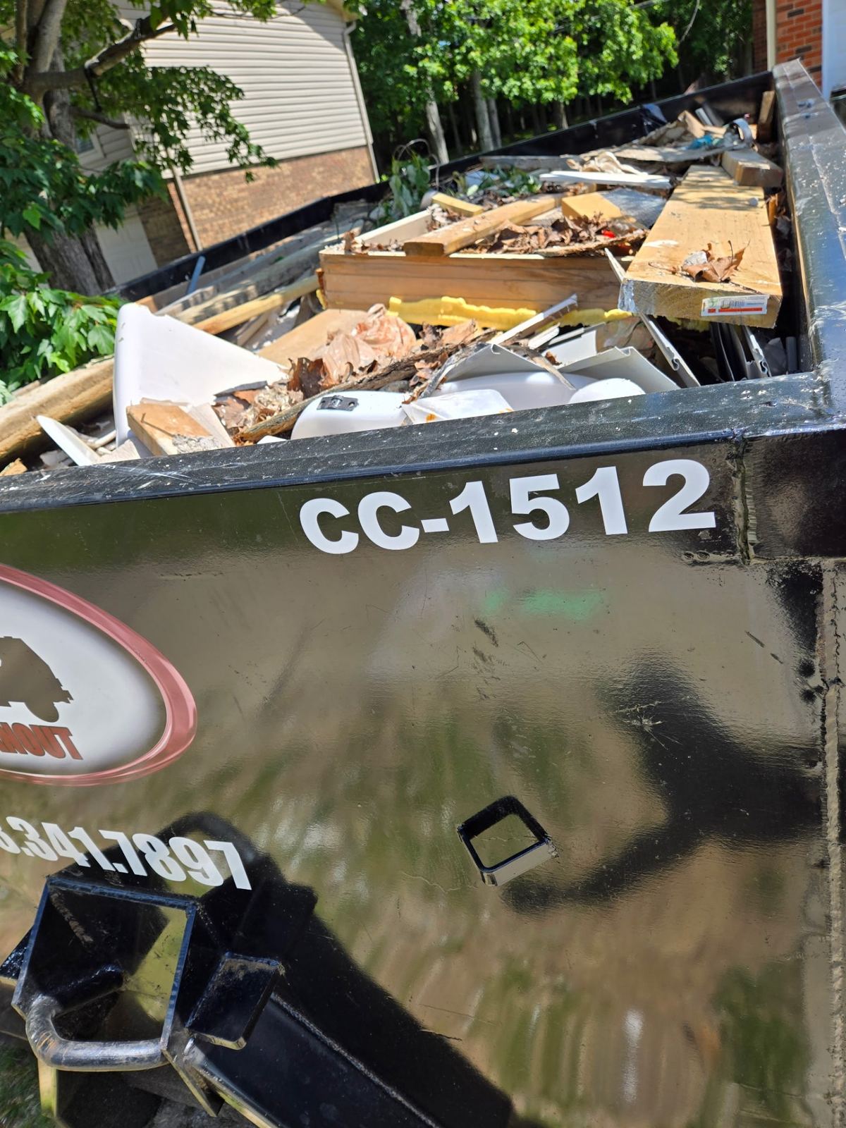 Loaded 15-yard construction dumpster CC-1512 in West Chester, OH filled with framing lumber, drywall, siding scrap and renovation debris